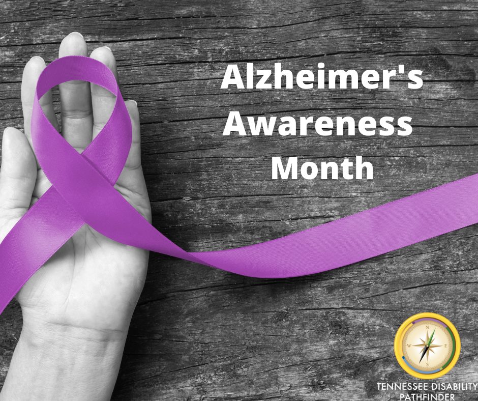 Image with a hand holding a purple ribbon with text mage of text that says 'Alzheimer's Awareness Month'