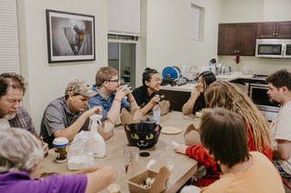 Image of people sitting around a table