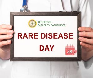 Image of a doctor in a white robe holding a frame with a white background. Text on frame "Rare Disease Day". There is a small image of a pink calendar with number 28 at the bottom right corner of the frame. Pathfinder's branded graphic is at the top and center of the frame.