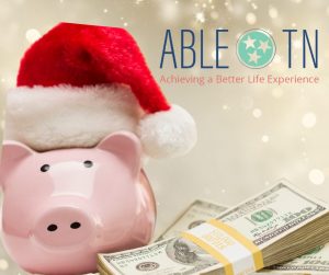 light gold sparkle background image with a pink piggy bank wearing a red and white santa hat on the left of the image and money stacks on the right of the image. ABLE TN's branded graphic is on the top right of the imeage.