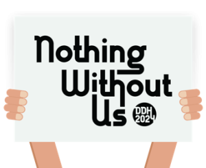 Graphic with hands holiding a white sign with text, "Nothing Without Us DDH 2024."