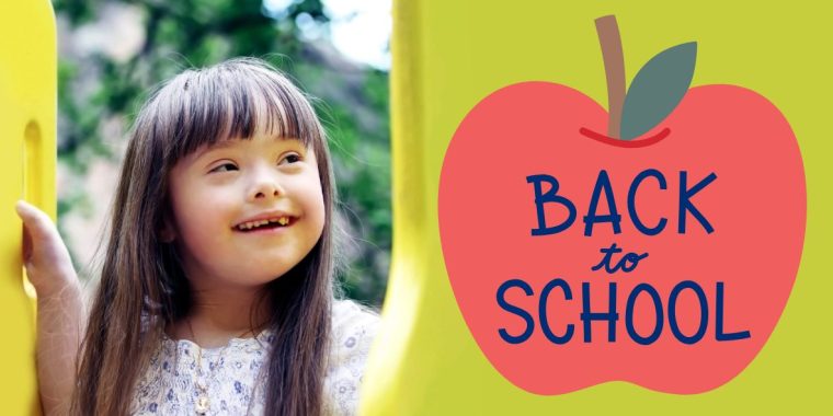 A child with long brown hair stands outdoors between two yellow playground structures, wearing a white patterned shirt. On the right side of the image, there is a large red apple graphic with green leaves and a brown stem on a light green background. Inside the apple, blue text reads "BACK to SCHOOL." The scene suggests a back-to-school theme.